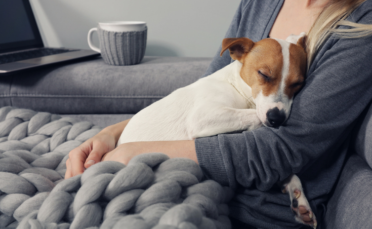 woman holding dog